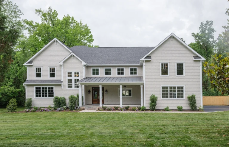A finished Character Companies home with a covered front porch and lawn